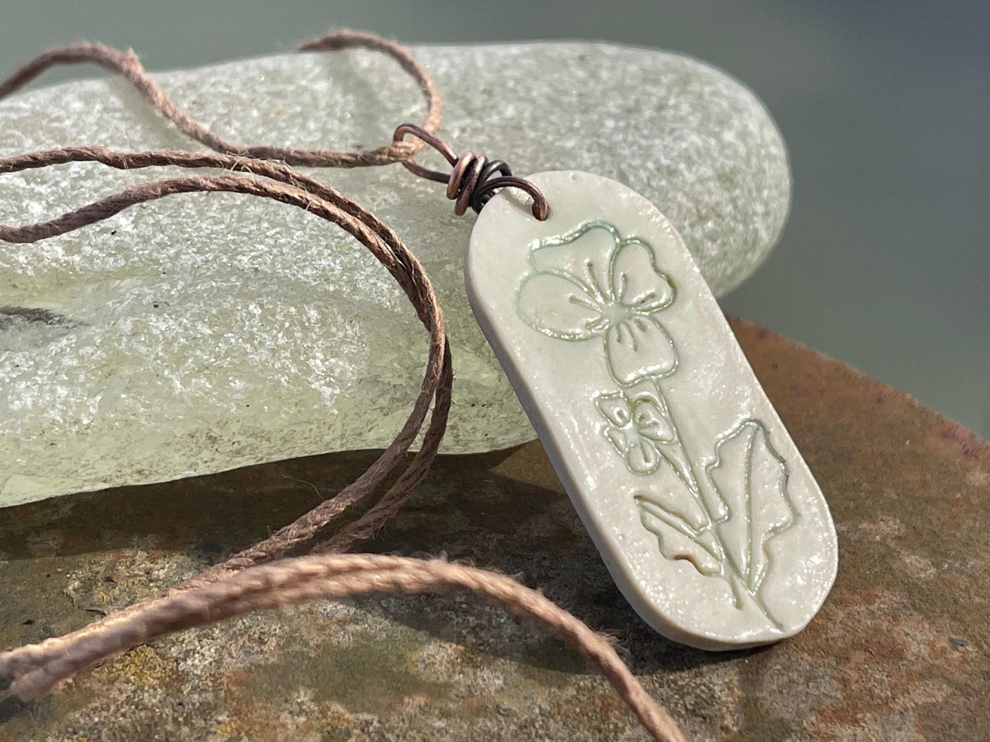 Handmade Poppy necklace. Eco friendly jewellery. Ethical pendants made with waste clay and burnt recycled copper. Ethical jewellery.