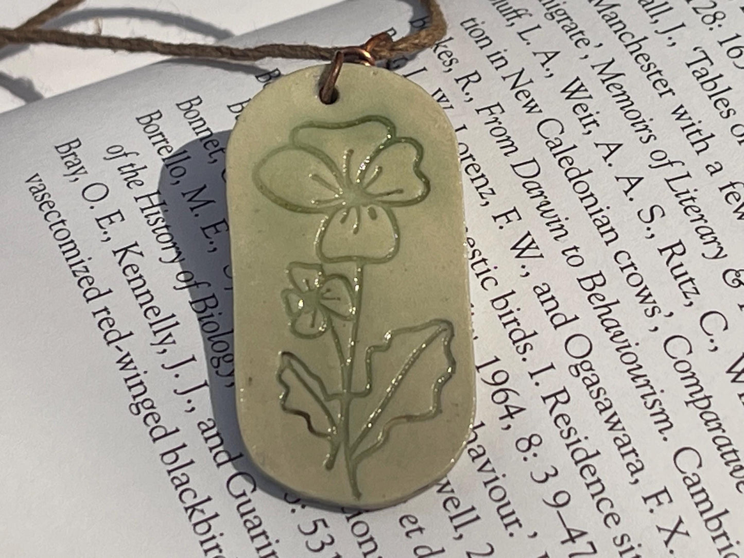 Handmade Poppy necklace. Eco friendly jewellery. Ethical pendants made with waste clay and burnt recycled copper. Ethical jewellery.