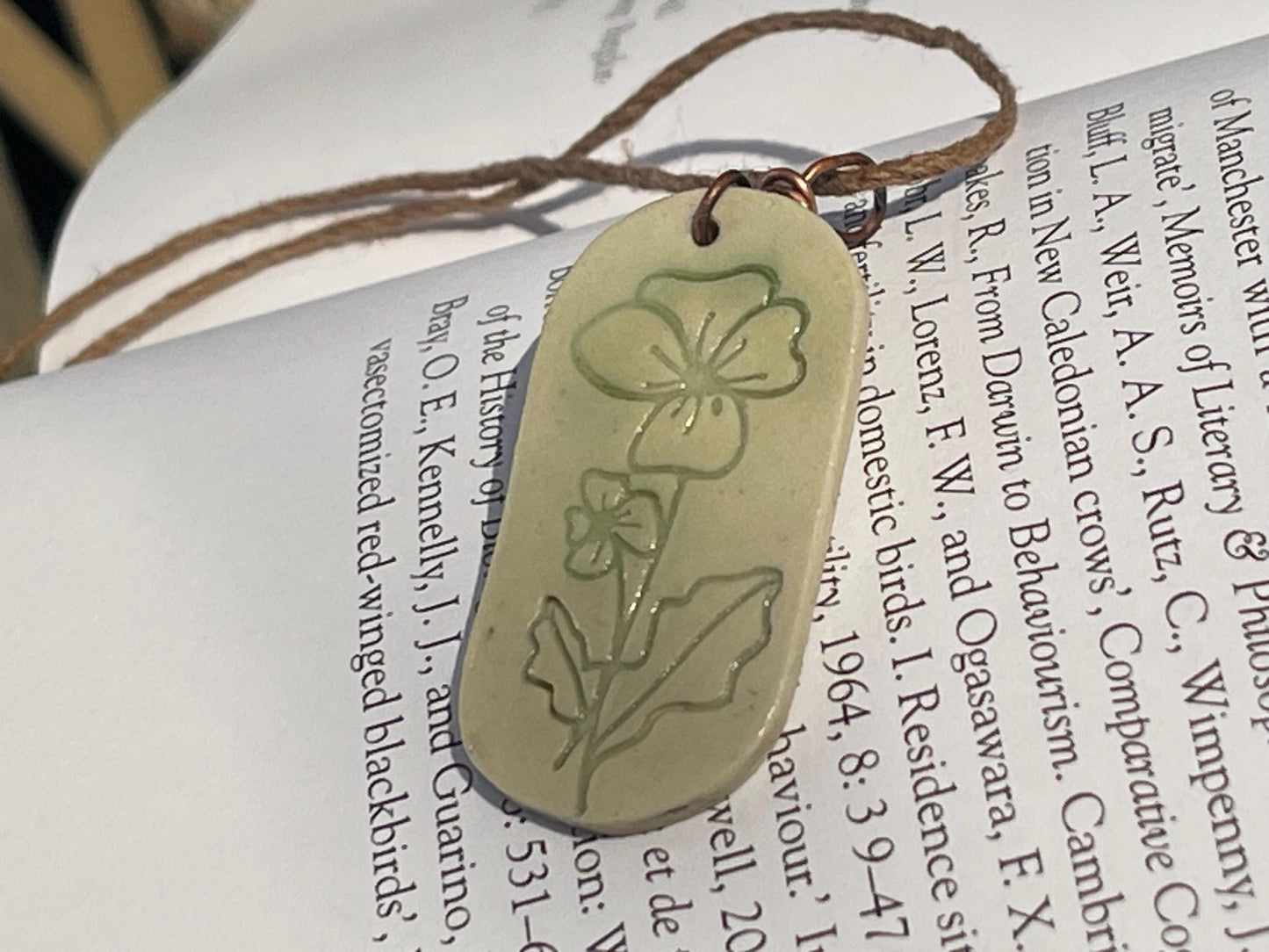 Handmade Poppy necklace. Eco friendly jewellery. Ethical pendants made with waste clay and burnt recycled copper. Ethical jewellery.