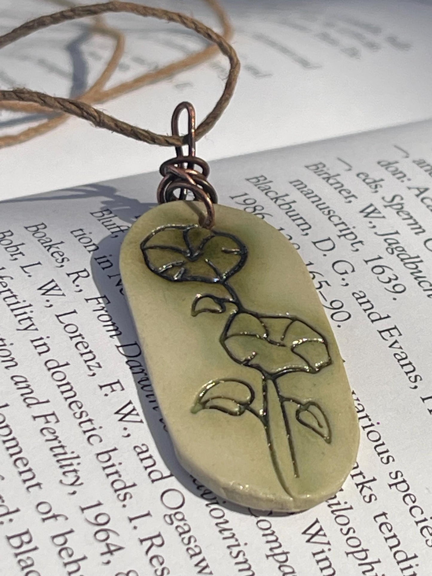 Handmade morning glory necklace. Eco friendly jewellery. Ethical pendants made with waste clay and burnt recycled copper. Ethical jewellery.