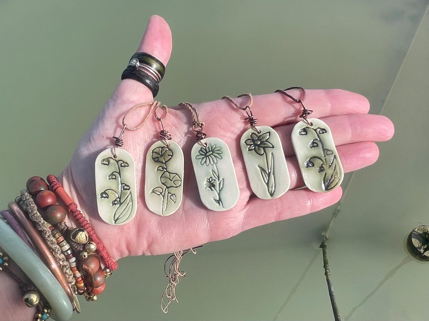 Handmade morning glory necklace. Eco friendly jewellery. Ethical pendants made with waste clay and burnt recycled copper. Ethical jewellery.