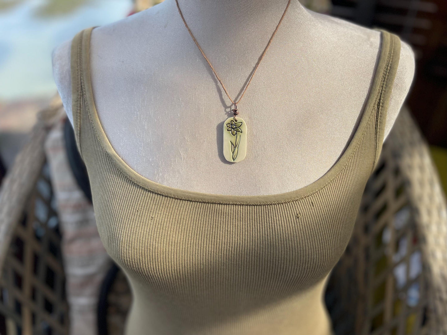 Handmade daffodil necklace. Eco friendly jewellery. Ethical pendants made with waste clay and burnt recycled copper. Ethical jewellery.