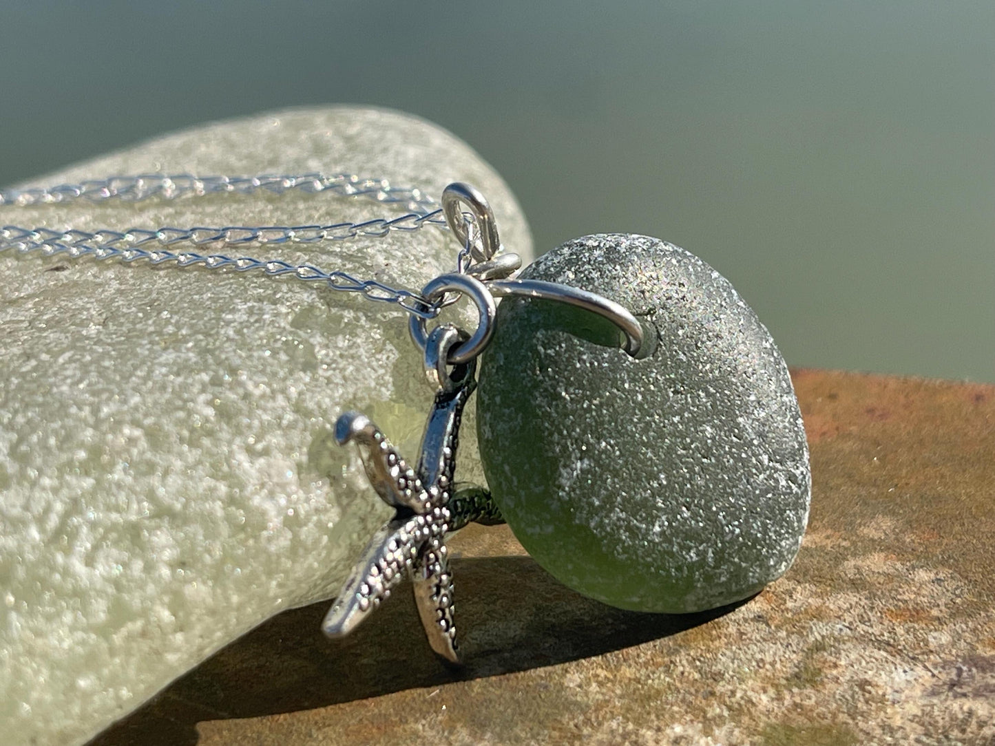 Eco friendly sea glass necklace on a sterling silver chain showcasing a little starfish. Starfish pendant,  eco friendly jewellery. Boho