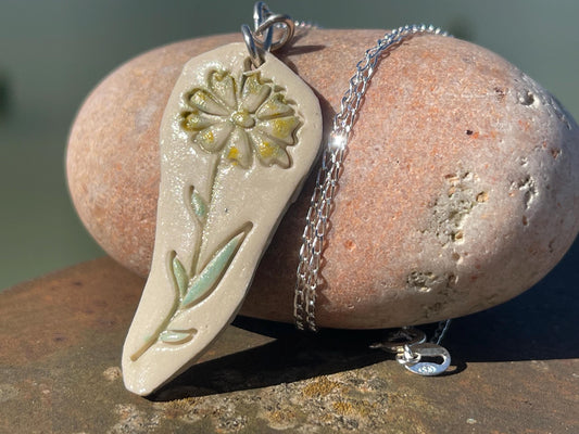 Handmade daisy necklace. Eco friendly jewellery. Ethical pendants made with waste clay and recycled sterling silver. Ethical jewellery.