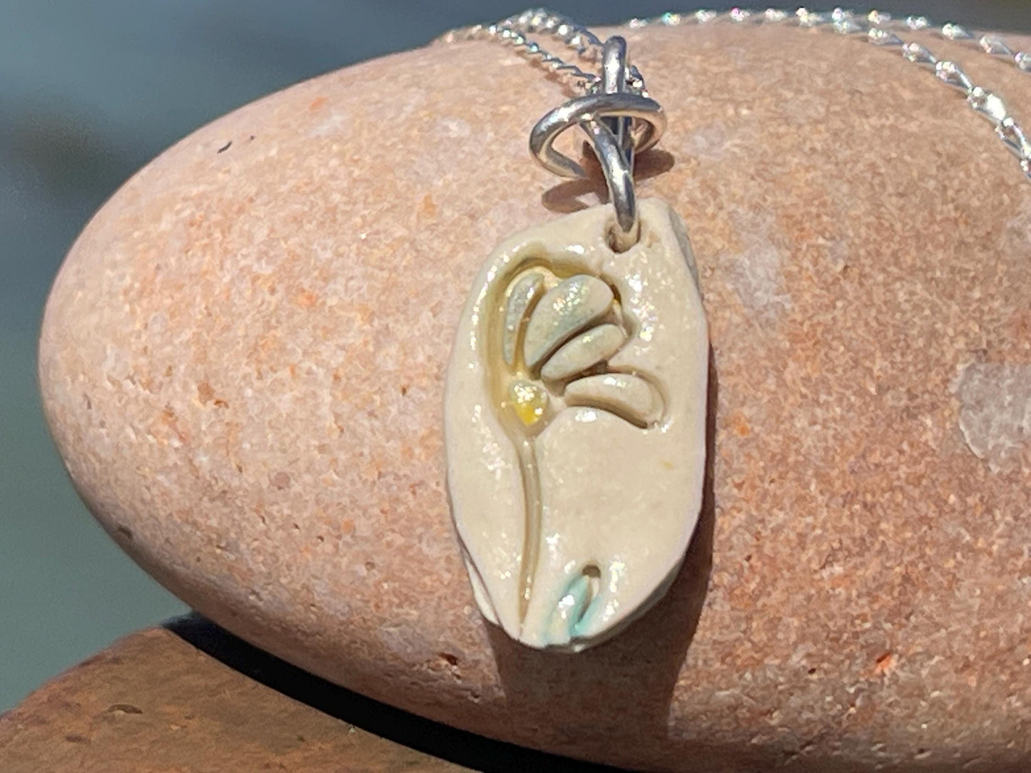 Handmade porcelain daisy pendant. Eco friendly jewellery. Handmade daisy necklaces on recycled sterling silver. Ethical jewellery. Eco gifts.