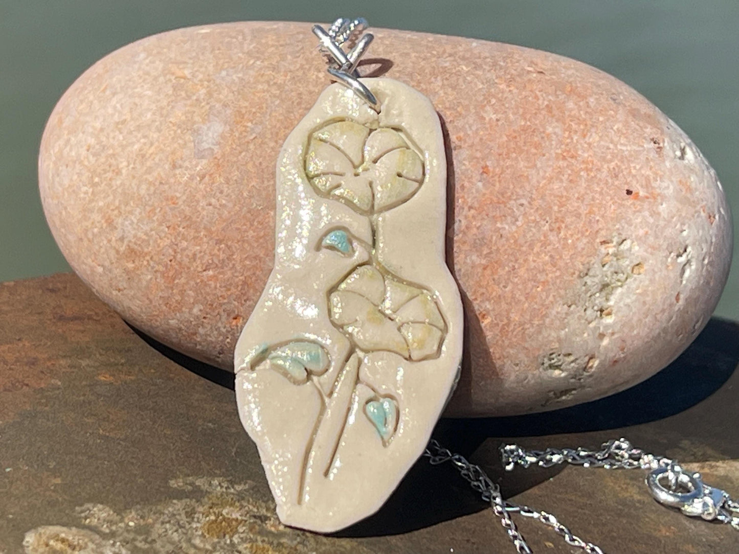 Handmade morning glory necklace. Eco friendly jewellery. Ethical pendants made with waste clay and recycled silver. Ethical jewellery.
