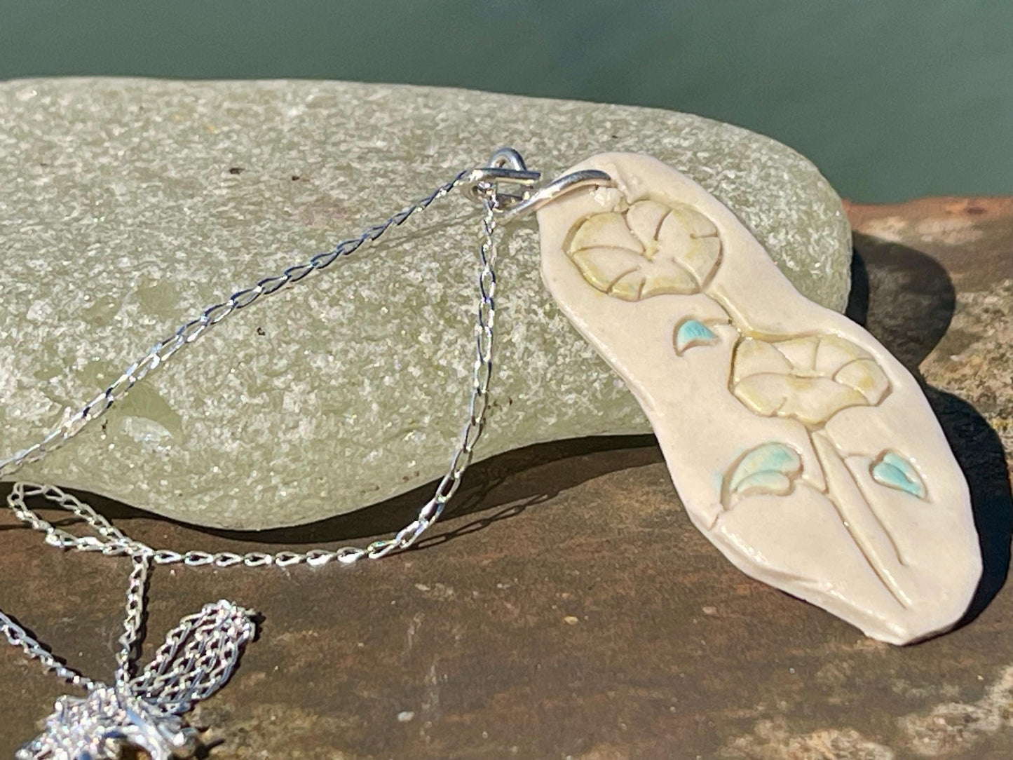 Handmade morning glory necklace. Eco friendly jewellery. Ethical pendants made with waste clay and recycled silver. Ethical jewellery.