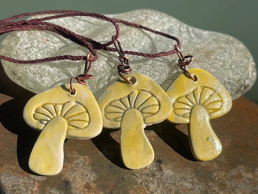 Handmade mushroom necklaces. Eco friendly jewellery. Ethical pendants made with waste clay and burnt recycled copper. Ethical jewellery.