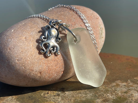 Eco friendly sea glass necklace on a sterling silver chain showcasing a little octopus. Octopus pendant, eco friendly jewellery.