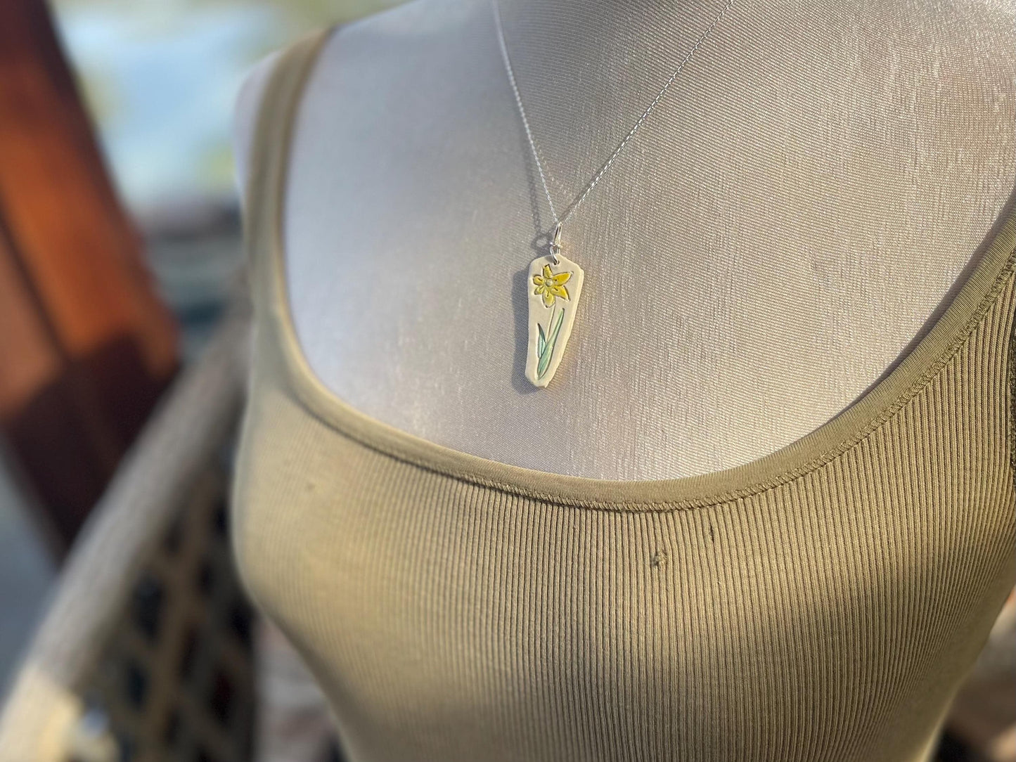 Handmade daffodil necklace. Eco friendly jewellery. Ethical pendants made with waste clay and recycled sterling silver. Ethical jewellery.
