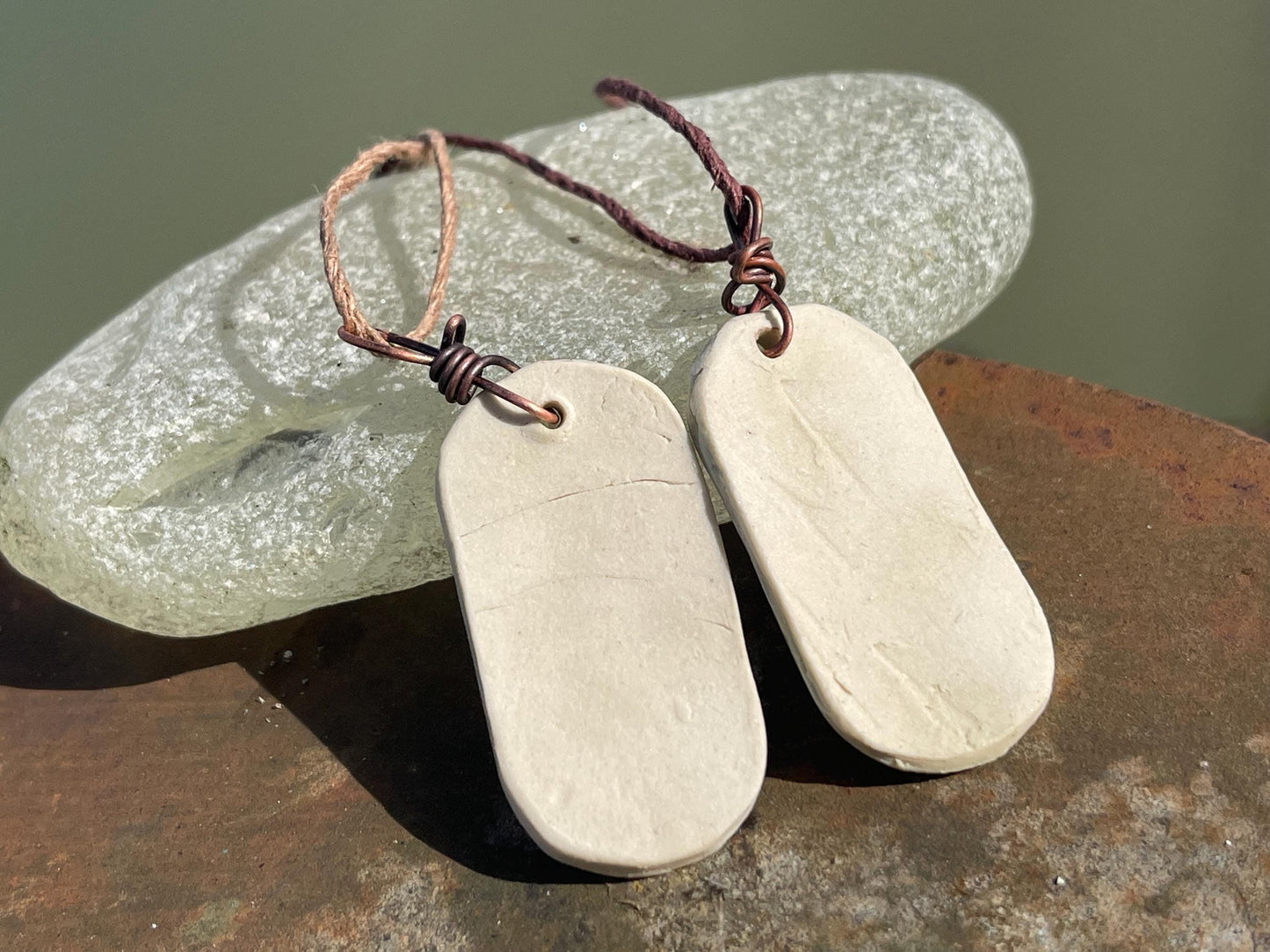 Handmade snowdrop necklace. Eco friendly jewellery. Ethical pendants made with waste clay and burnt recycled copper. Ethical jewellery.