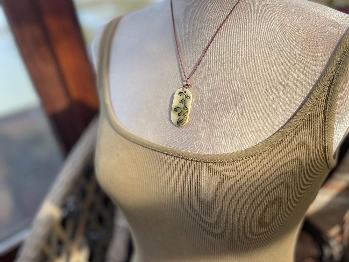 Handmade snowdrop necklace. Eco friendly jewellery. Ethical pendants made with waste clay and burnt recycled copper. Ethical jewellery.