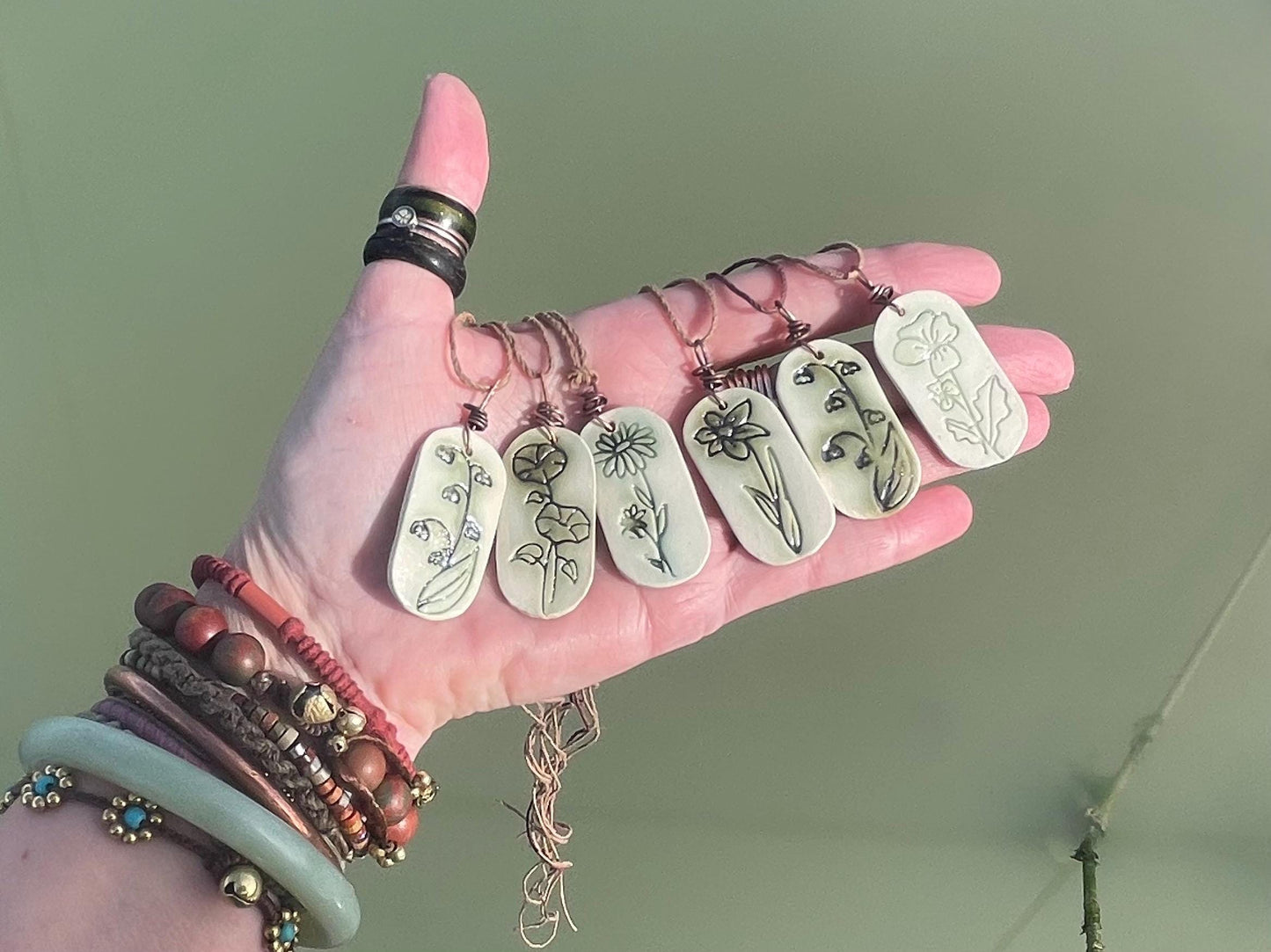 Handmade Poppy necklace. Eco friendly jewellery. Ethical pendants made with waste clay and burnt recycled copper. Ethical jewellery.