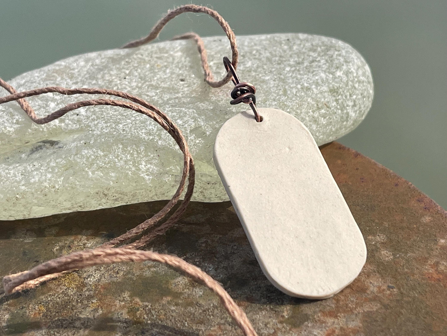 Handmade Poppy necklace. Eco friendly jewellery. Ethical pendants made with waste clay and burnt recycled copper. Ethical jewellery.