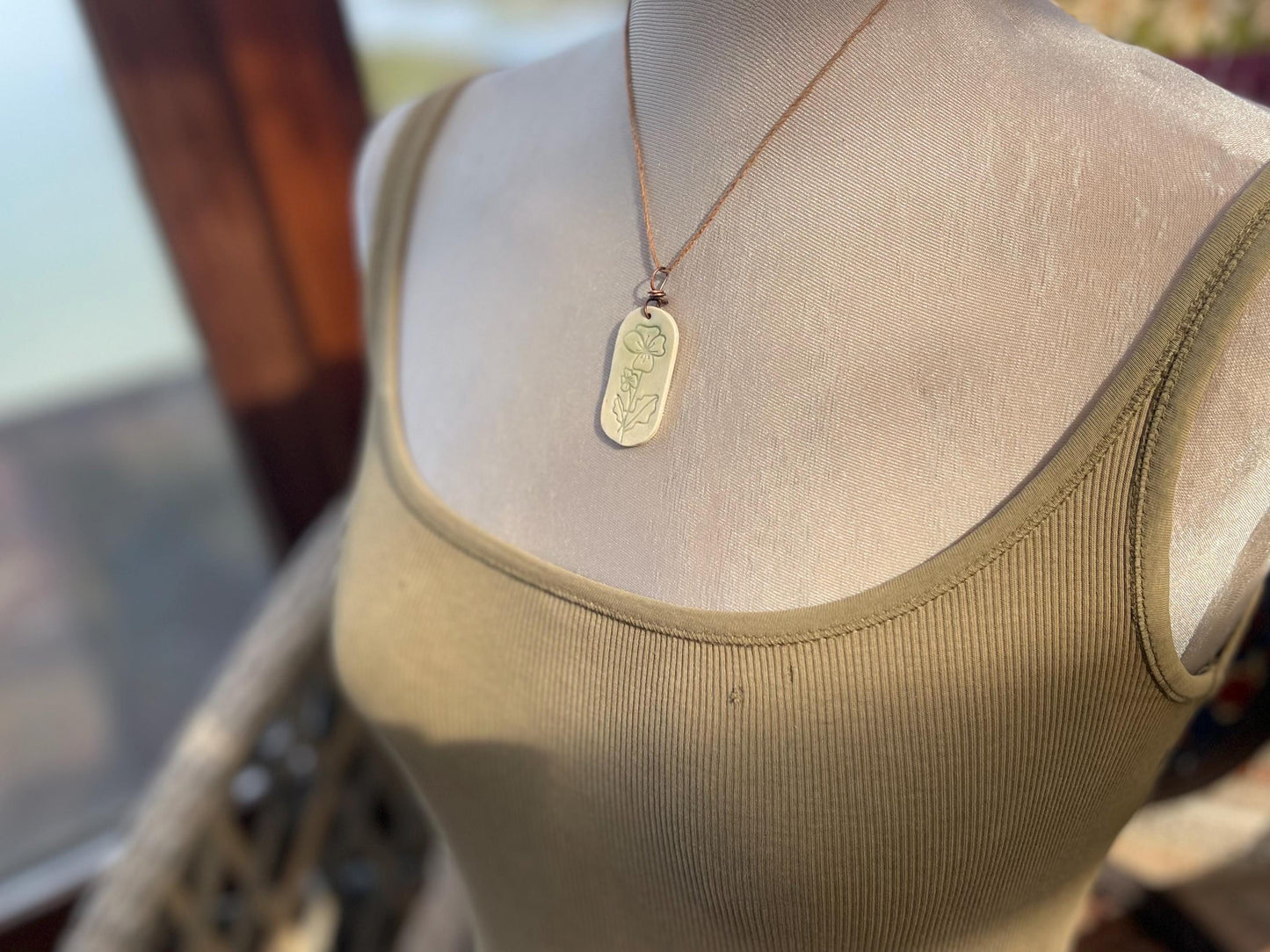 Handmade Poppy necklace. Eco friendly jewellery. Ethical pendants made with waste clay and burnt recycled copper. Ethical jewellery.