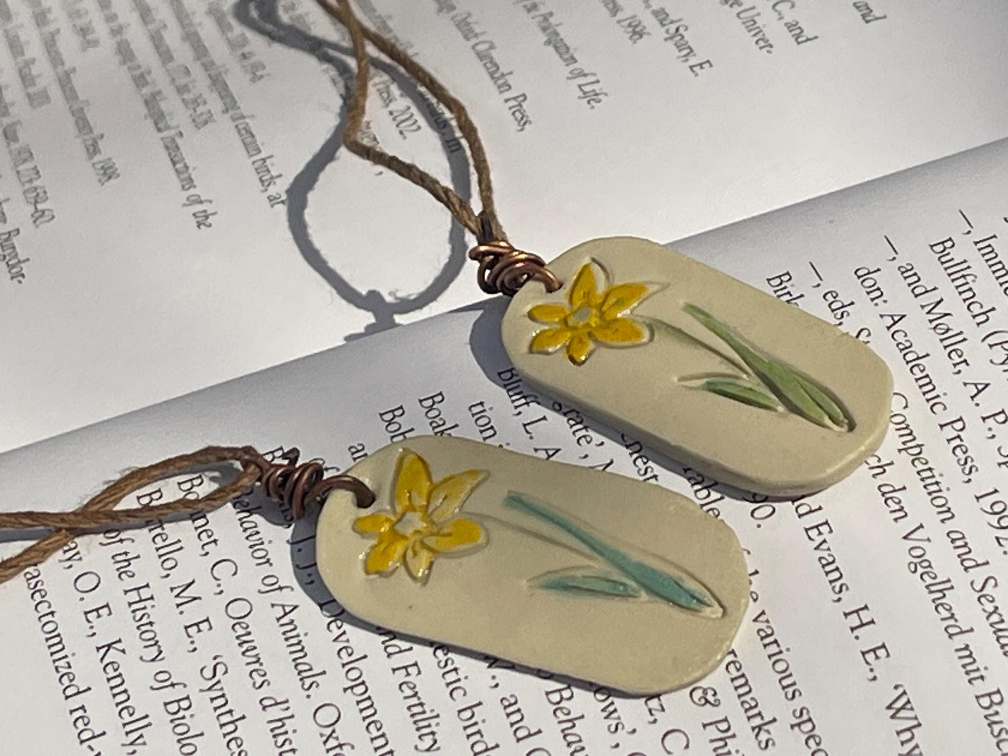 Handmade daffodil necklace. Eco friendly jewellery. Ethical pendants made with waste clay and burnt recycled copper. Ethical jewellery.