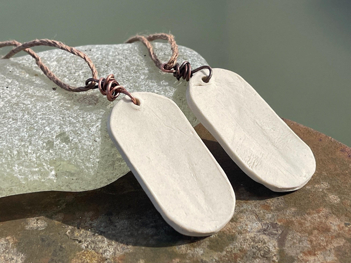 Handmade daffodil necklace. Eco friendly jewellery. Ethical pendants made with waste clay and burnt recycled copper. Ethical jewellery.