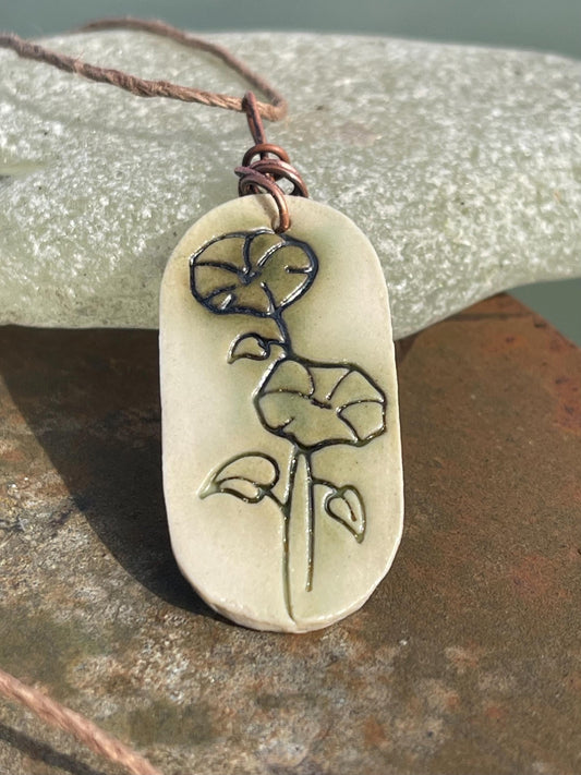 Handmade morning glory necklace. Eco friendly jewellery. Ethical pendants made with waste clay and burnt recycled copper. Ethical jewellery.