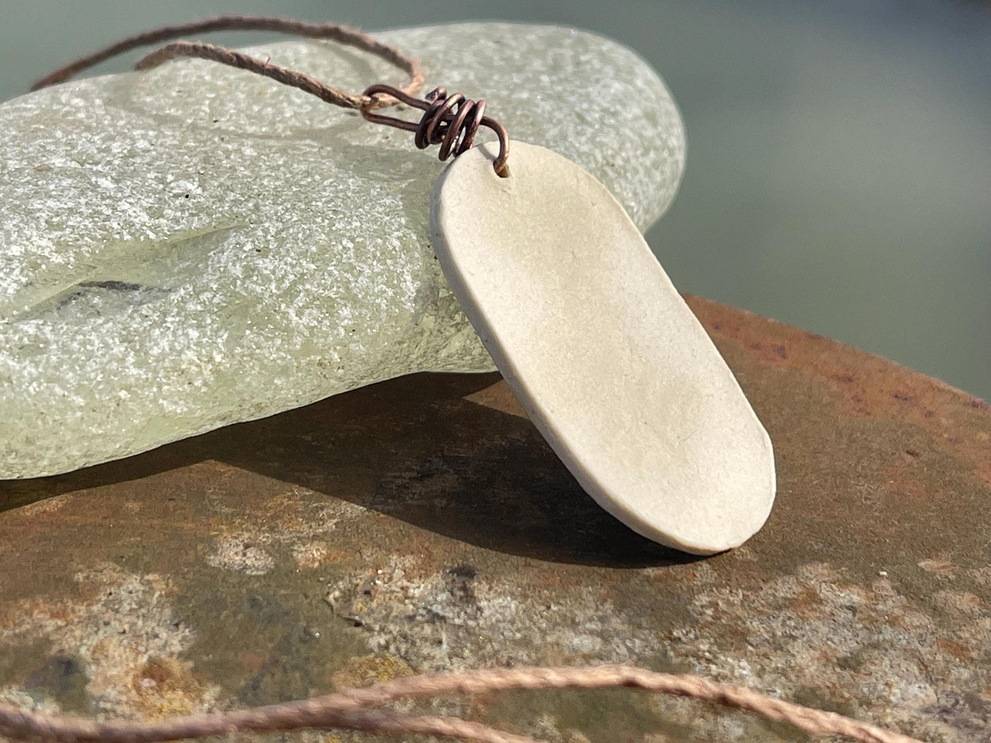 Handmade morning glory necklace. Eco friendly jewellery. Ethical pendants made with waste clay and burnt recycled copper. Ethical jewellery.