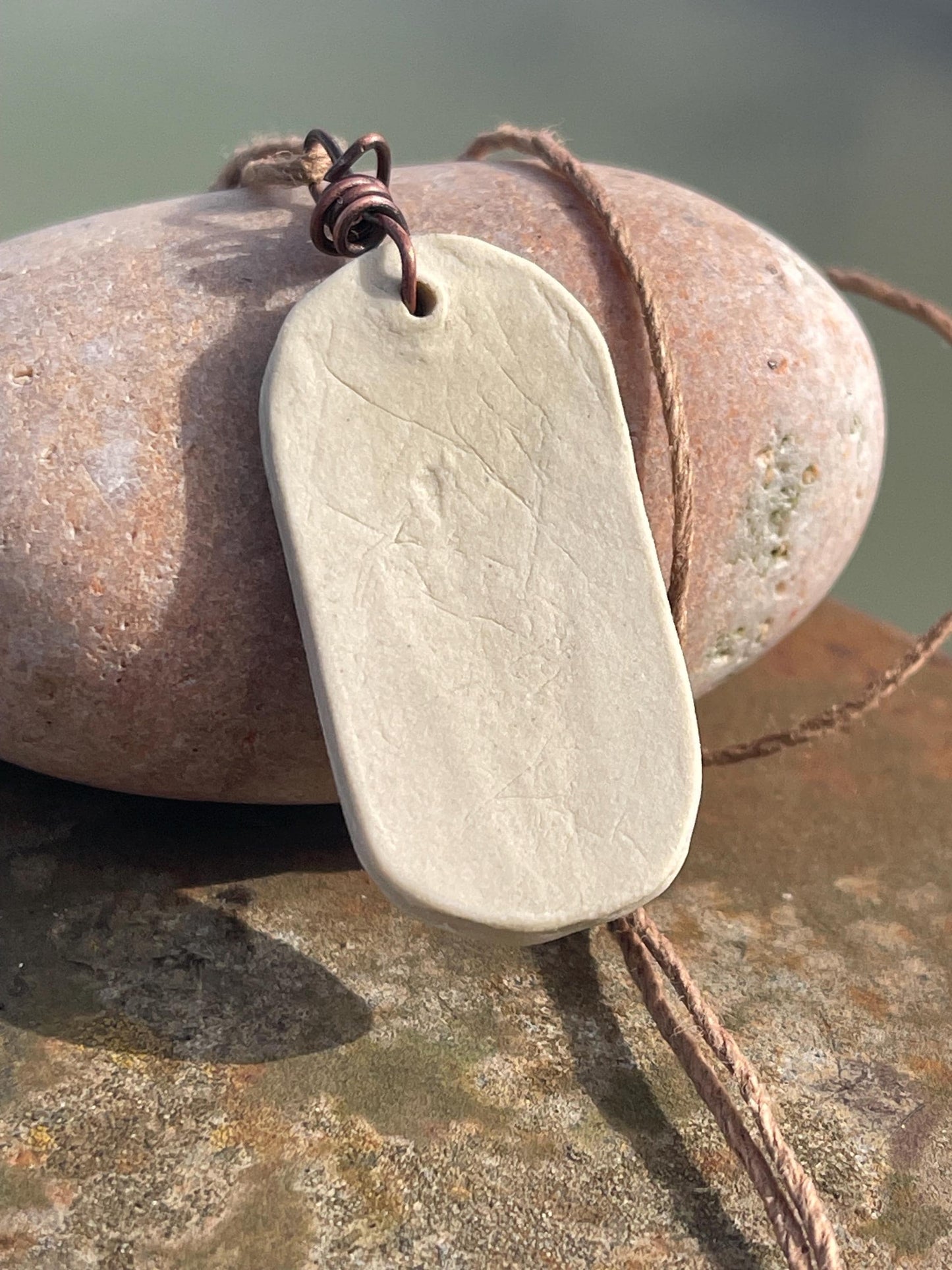 Handmade daffodil necklace. Eco friendly jewellery. Ethical pendants made with waste clay and burnt recycled copper. Ethical jewellery.