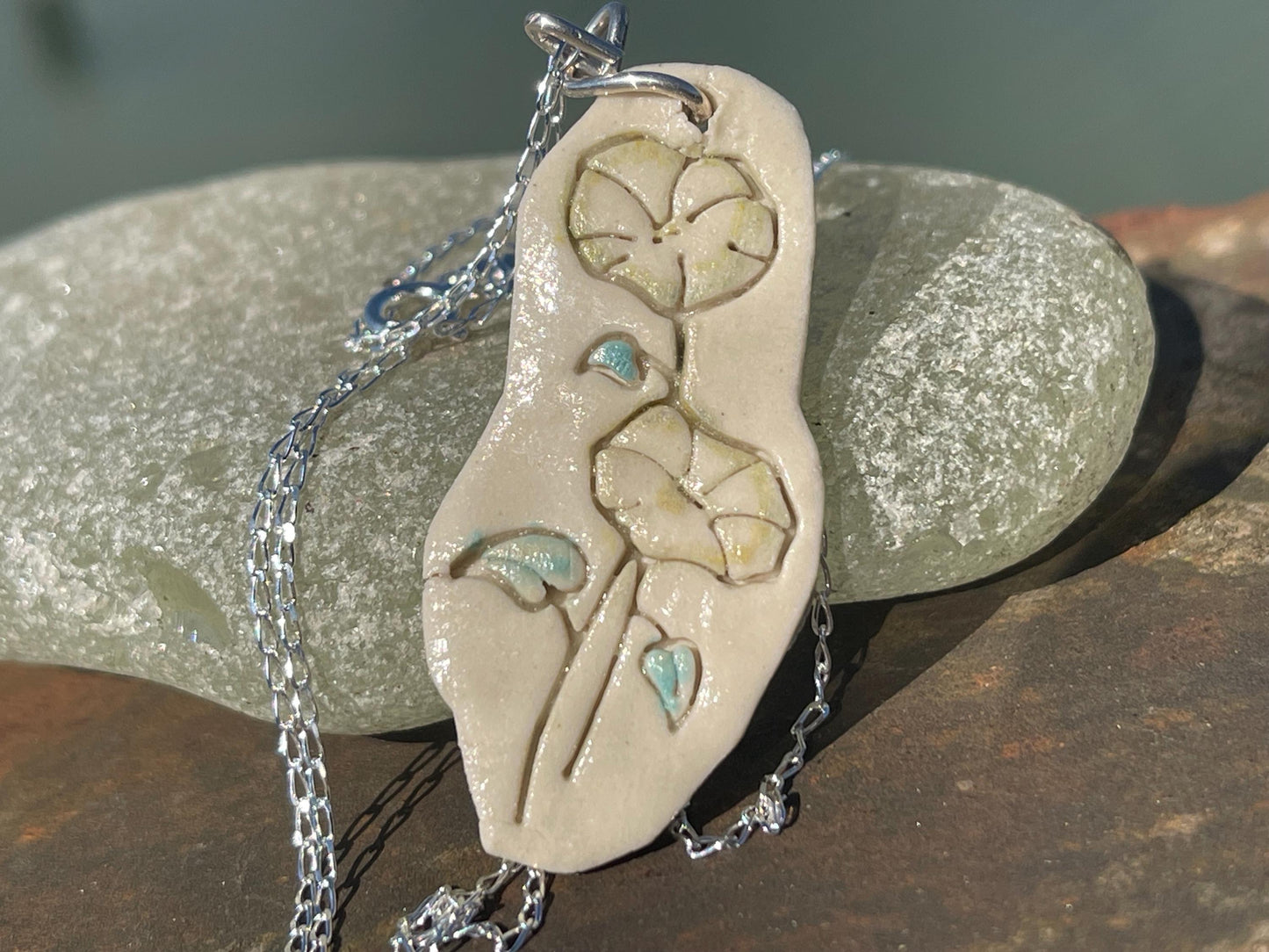 Handmade morning glory necklace. Eco friendly jewellery. Ethical pendants made with waste clay and recycled silver. Ethical jewellery.