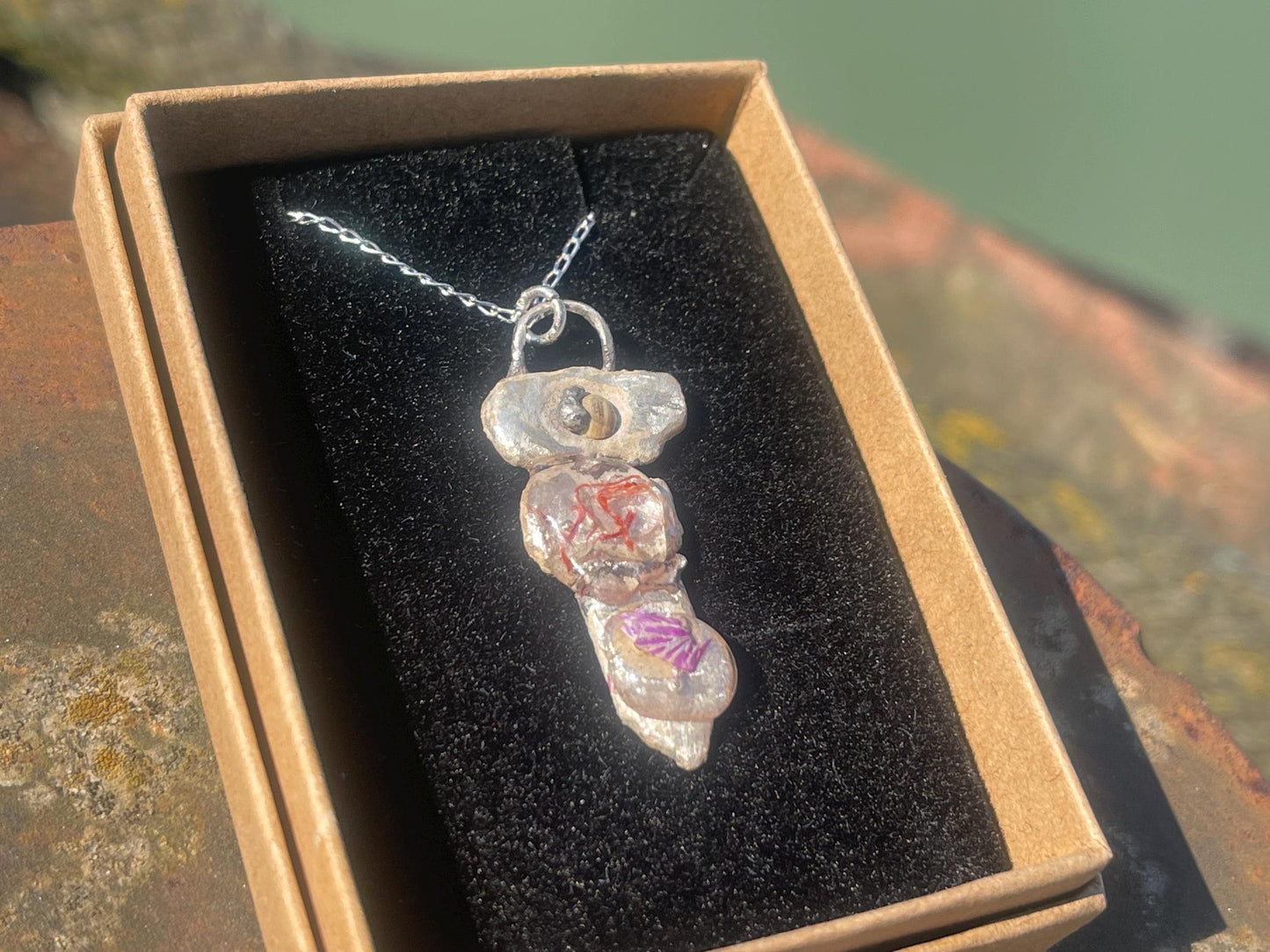 Recycled silver artisan necklace. On sale as it is a practice piece. Integrating seaweed and a violet petal. Unique silver artisan necklace.