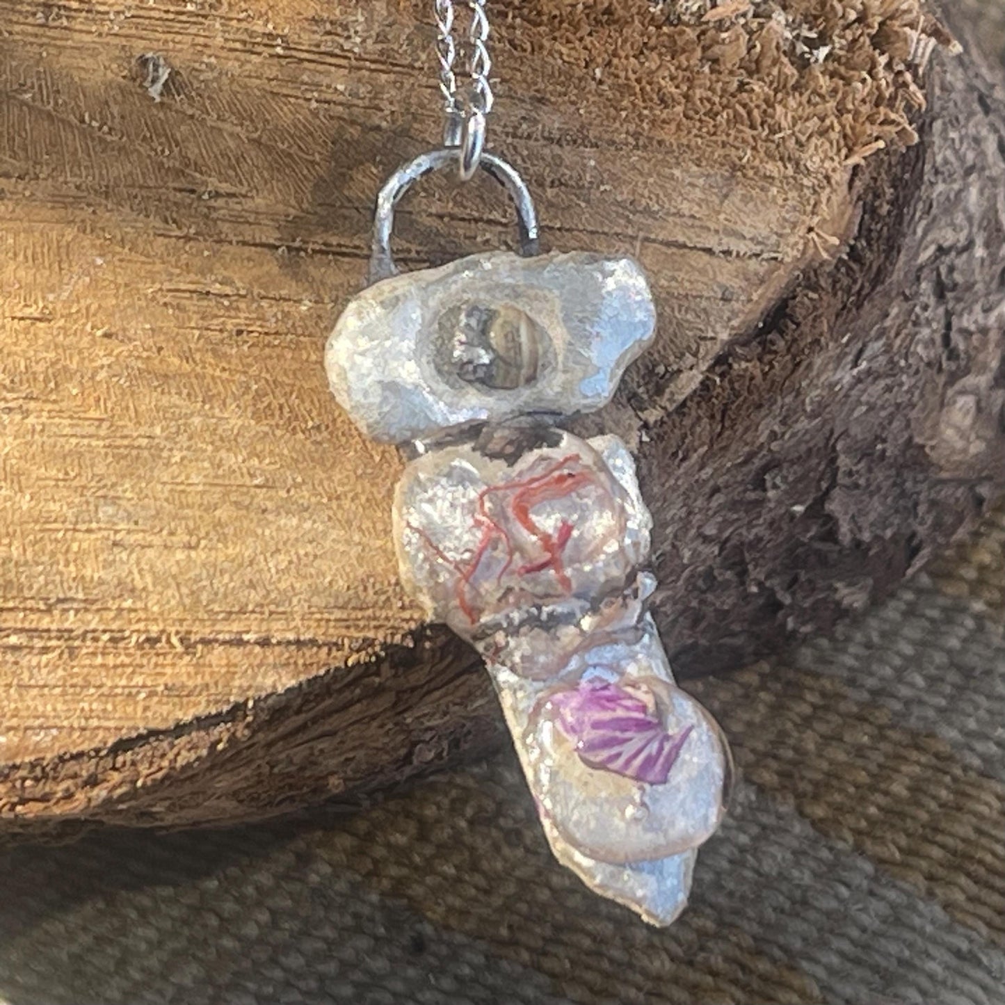 Recycled silver artisan necklace. On sale as it is a practice piece. Integrating seaweed and a violet petal. Unique silver artisan necklace.