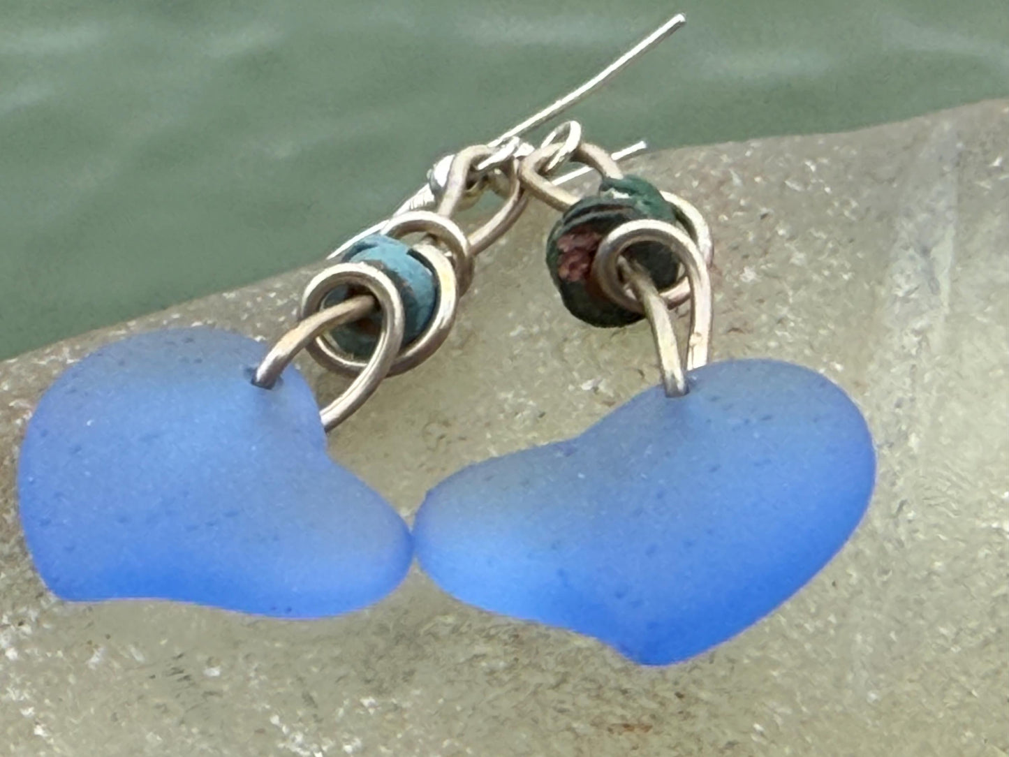 Blue glass heart earrings on recycled sterling silver. Eco conscious jewellery. Ethical jewellery. Blue glass hearts. Handmade earrings