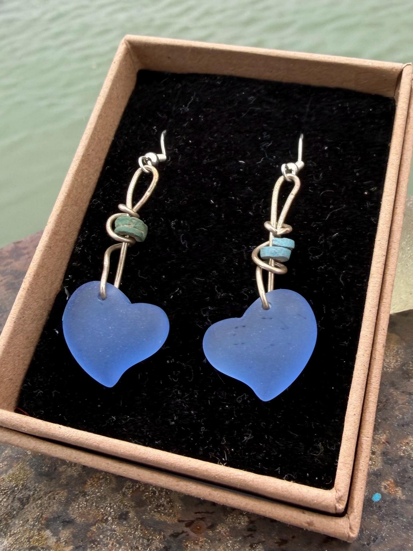 Blue glass heart earrings on recycled sterling silver. Eco conscious jewellery. Ethical jewellery. Blue glass hearts. Handmade earrings