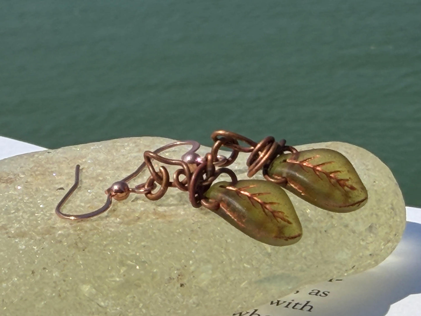 Upcycled glass leaves wrapped in recycled copper. Held on rose gold ear hooks. Eco friendly jewellery. Unique earrings. Leaf earrings.