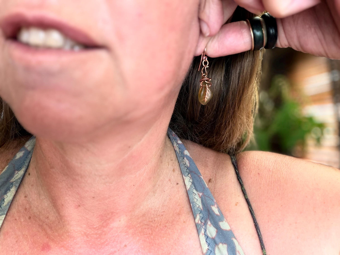 Upcycled glass leaves wrapped in recycled copper. Held on rose gold ear hooks. Eco friendly jewellery. Unique earrings. Leaf earrings.