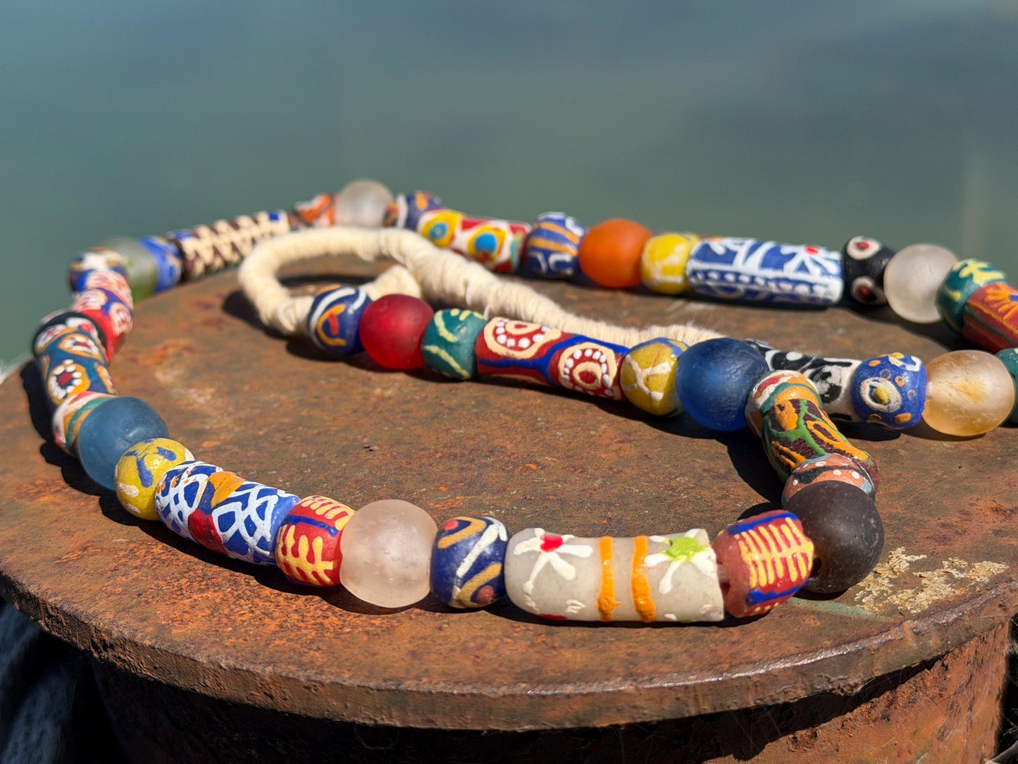 Fabulous hand painted glass necklaces. Recycled necklace, handmade bead necklace. Eco friendly jewellery. Ethical and sustainable gift.