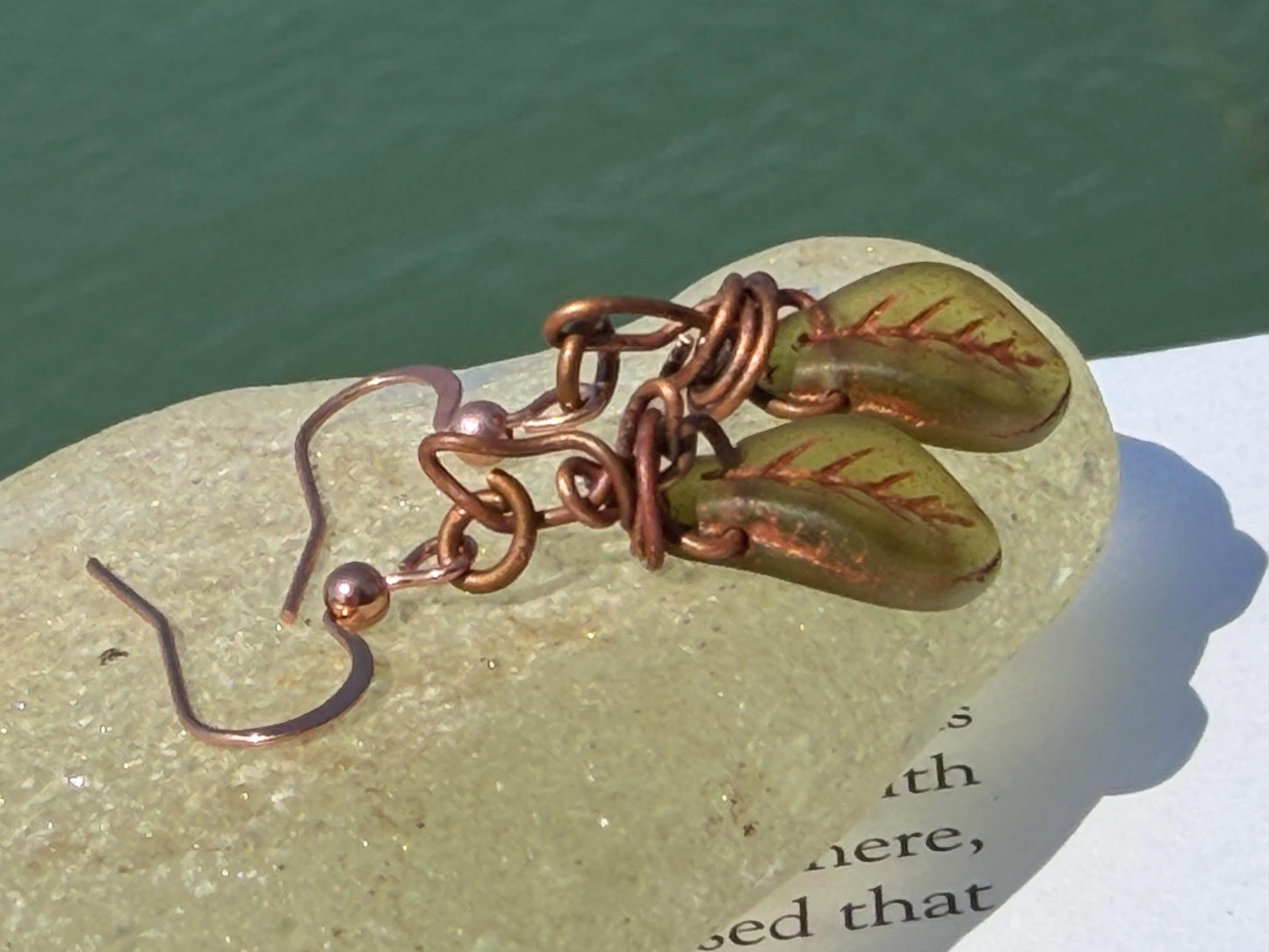 Upcycled glass leaves wrapped in recycled copper. Held on rose gold ear hooks. Eco friendly jewellery. Unique earrings. Leaf earrings.