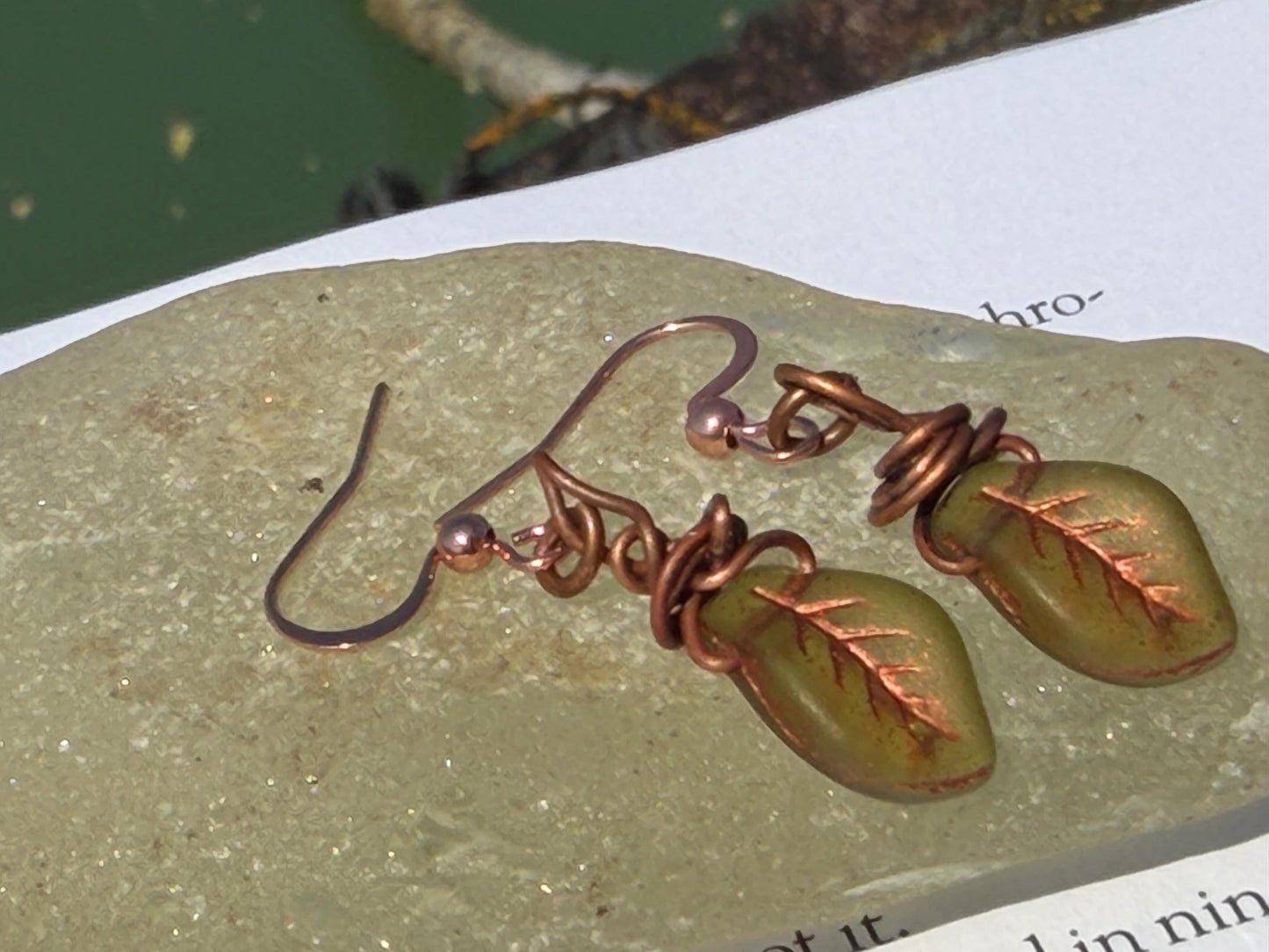 Upcycled glass leaves wrapped in recycled copper. Held on rose gold ear hooks. Eco friendly jewellery. Unique earrings. Leaf earrings.