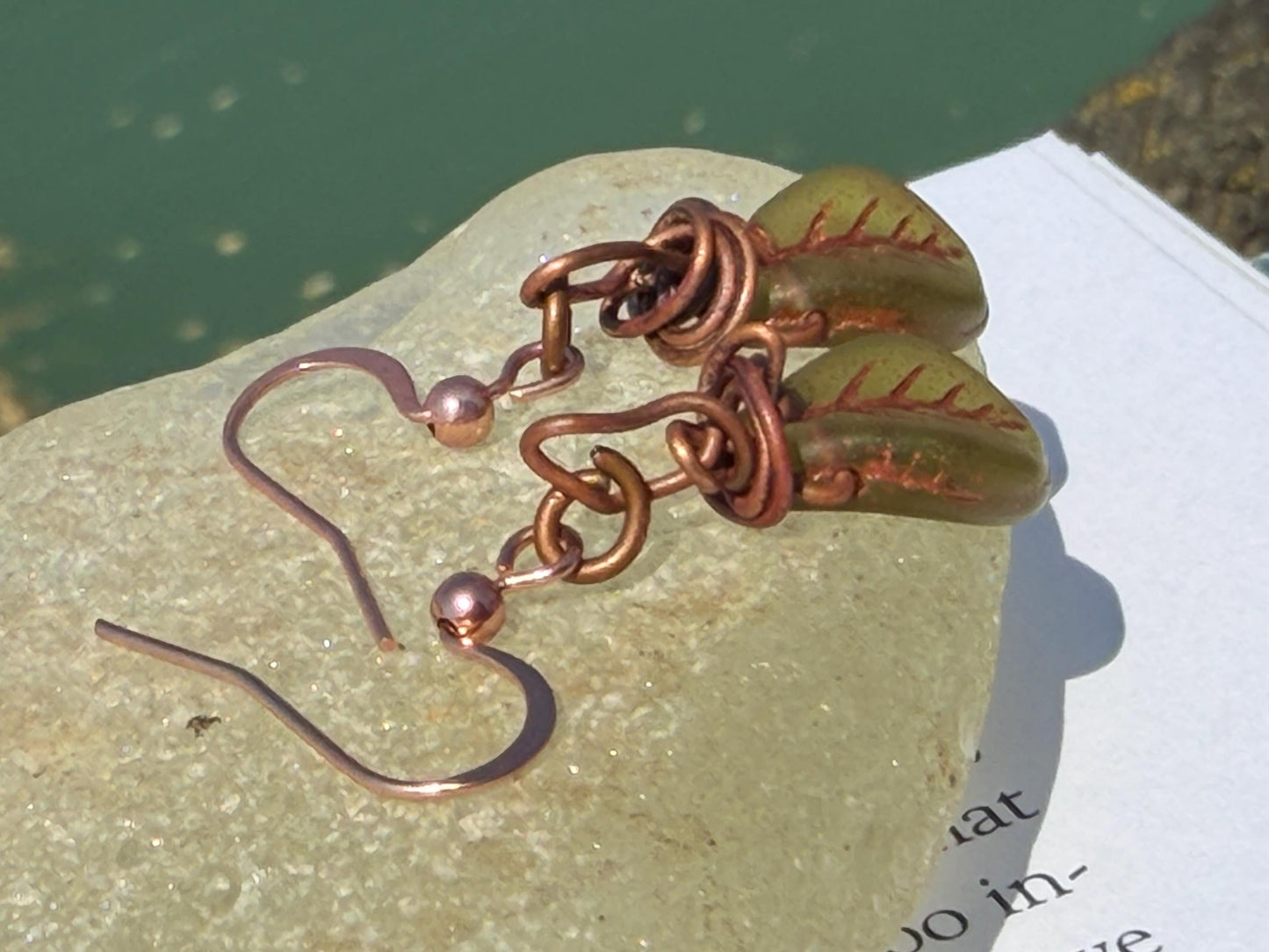 Upcycled glass leaves wrapped in recycled copper. Held on rose gold ear hooks. Eco friendly jewellery. Unique earrings. Leaf earrings.