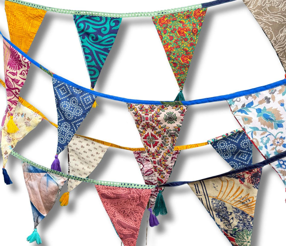 Recycled bunting with long ties and tassels. Boho bunting for home, garden and parties. Party flags with tassels.  Colourful  & eco friendly