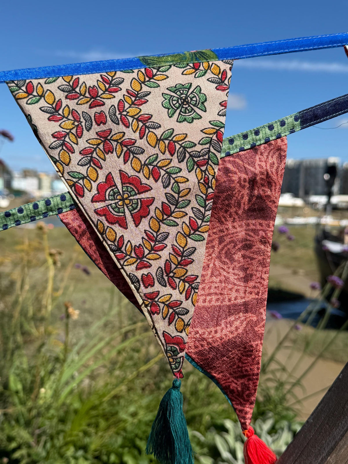 Recycled bunting with long ties and tassels. Boho bunting for home, garden and parties. Party flags with tassels.  Colourful  & eco friendly