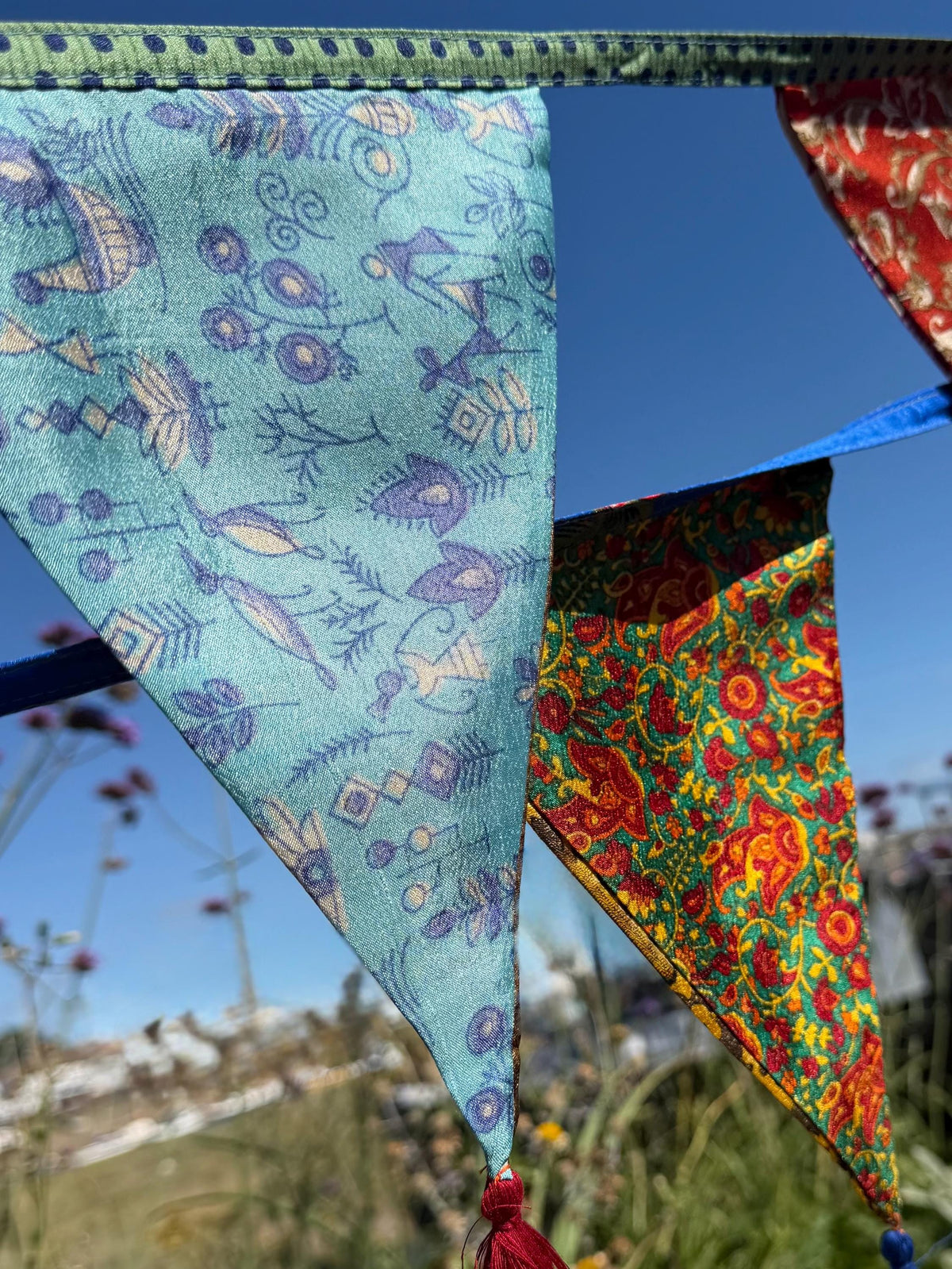 Recycled bunting with long ties and tassels. Boho bunting for home, garden and parties. Party flags with tassels.  Colourful  & eco friendly
