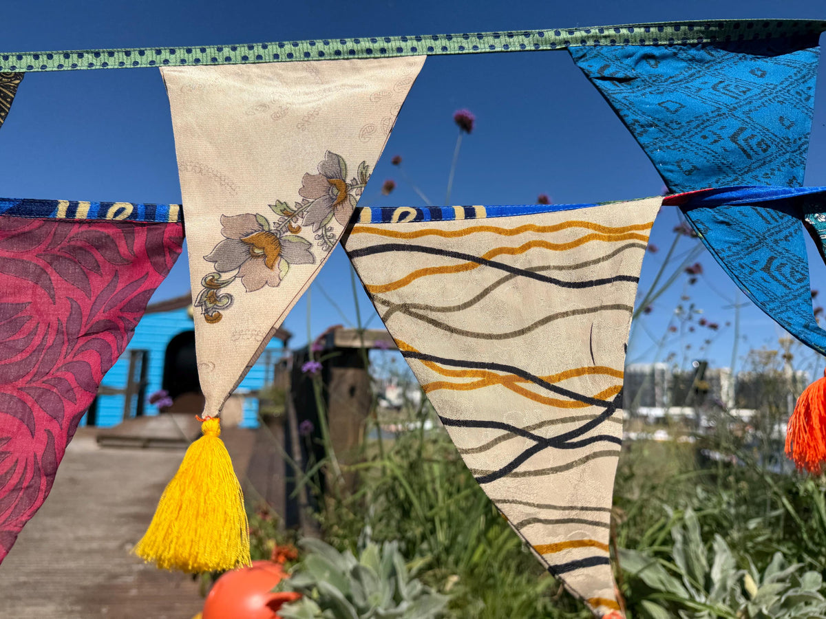 Recycled bunting with long ties and tassels. Boho bunting for home, garden and parties. Party flags with tassels.  Colourful  & eco friendly