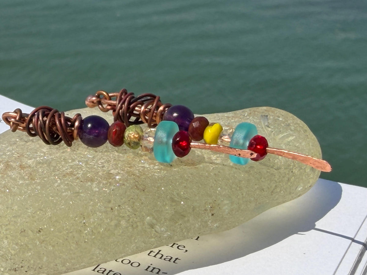 Eco friendly earrings made using recycled copper, sea glass & ethically sourced amethyst. Handmade ethical and unique jewellery.  Unusual.