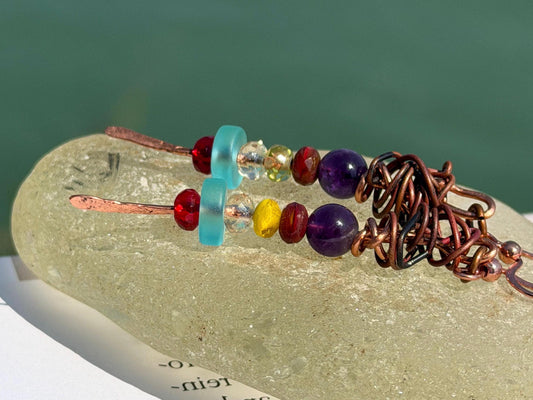 Eco friendly earrings made using recycled copper, sea glass & ethically sourced amethyst. Handmade ethical and unique jewellery.  Unusual.