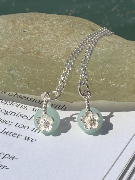 Dainty little recycled glass necklace within sterling silver flower. Recycled necklace. Ethical jewellery. glass pendant. Eco friendly gifts