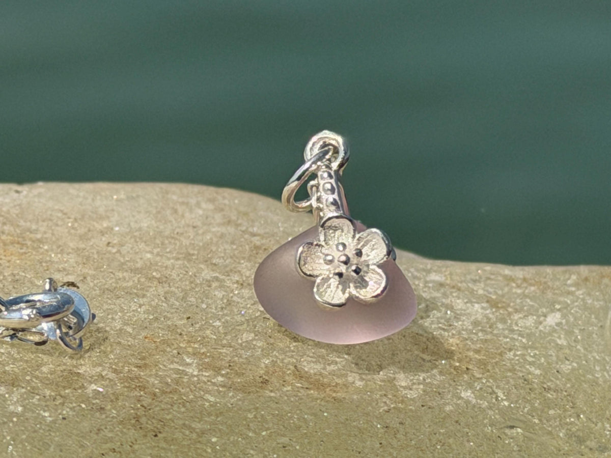 Dainty little recycled glass necklace within sterling silver flower. Recycled necklace. Ethical jewellery. glass pendant. Eco friendly gifts
