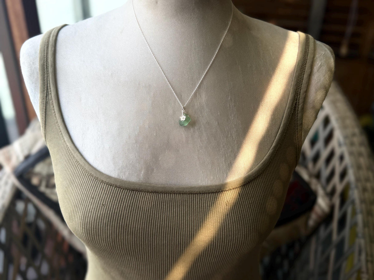 Dainty little sea glass necklace within sterling silver flowers. Recycled necklace. Ethical jewellery. Sea glass pendant. Eco friendly gifts