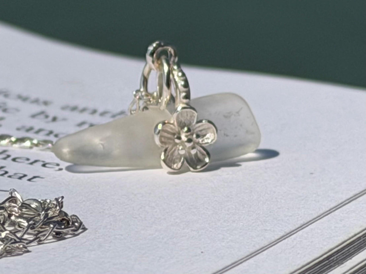 Dainty little sea glass necklace within sterling silver flowers. Recycled necklace. Ethical jewellery. Sea glass pendant. Eco friendly gifts
