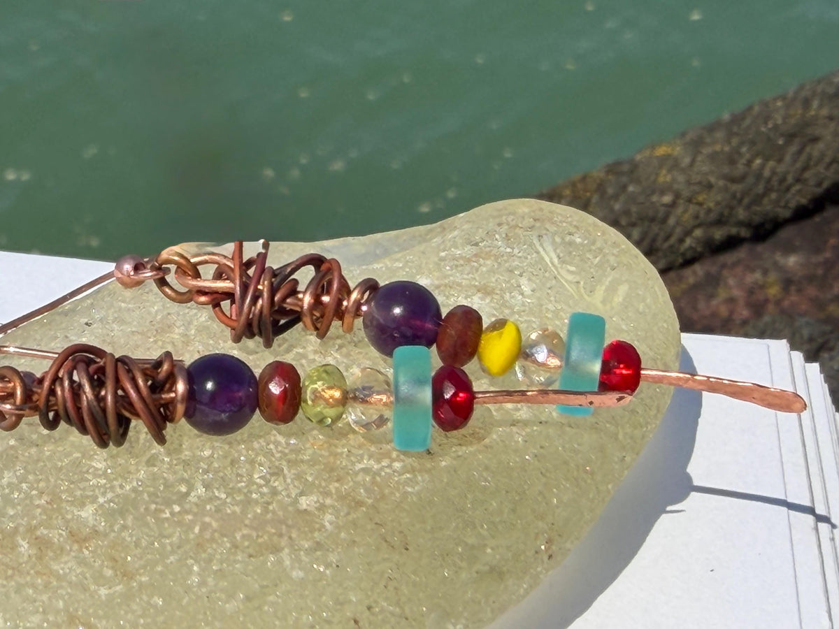 Eco friendly earrings made using recycled copper, sea glass & ethically sourced amethyst. Handmade ethical and unique jewellery.  Unusual.