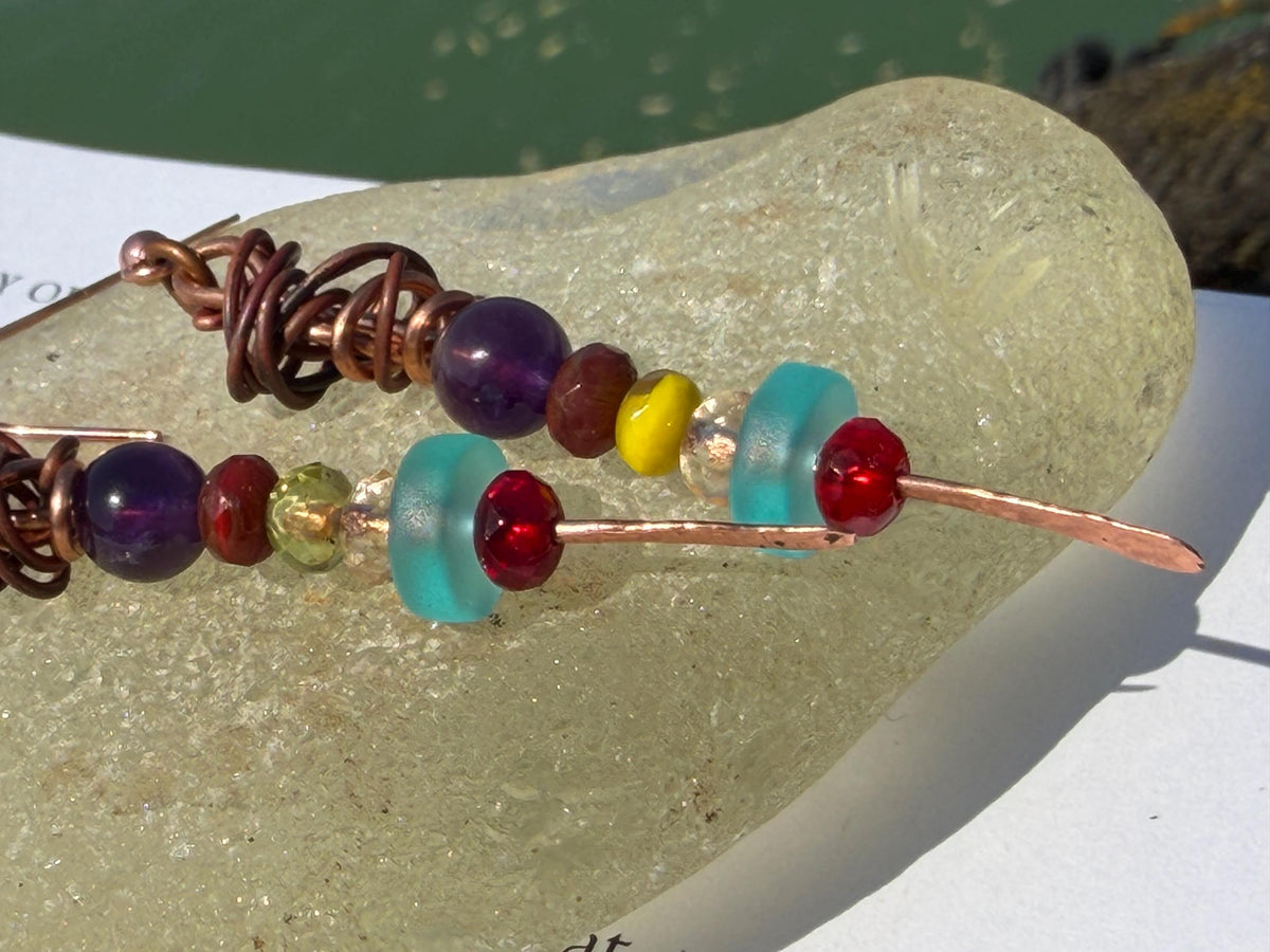 Eco friendly earrings made using recycled copper, sea glass & ethically sourced amethyst. Handmade ethical and unique jewellery.  Unusual.