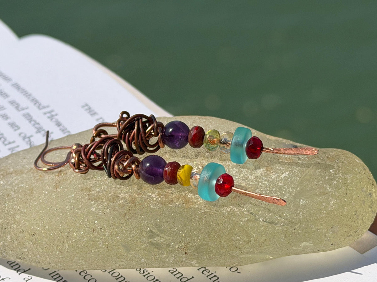 Eco friendly earrings made using recycled copper, sea glass & ethically sourced amethyst. Handmade ethical and unique jewellery.  Unusual.